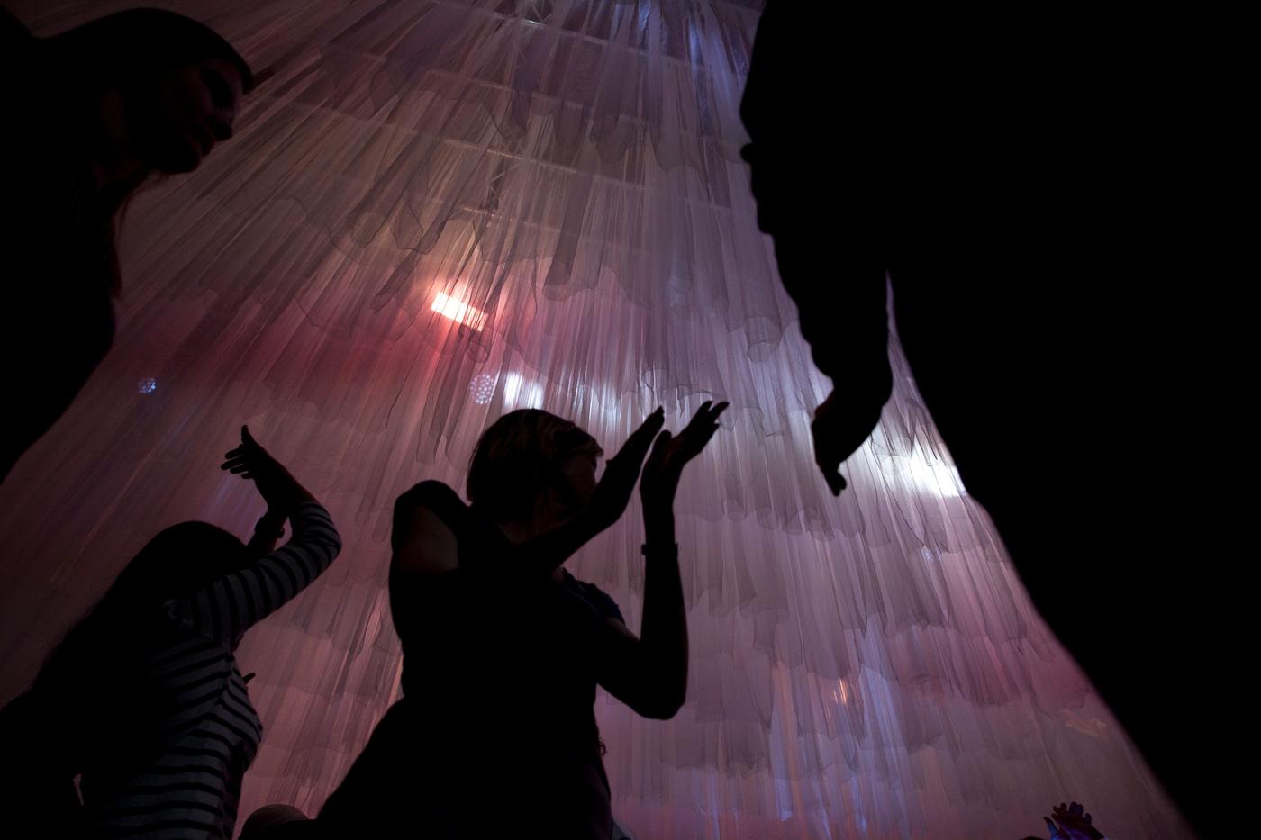 A person in a darkened room.