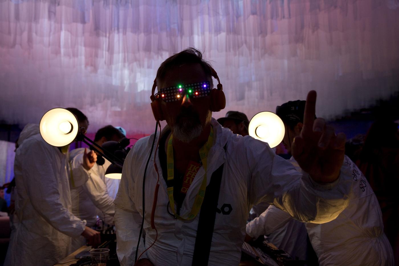 A person in a darkened room.