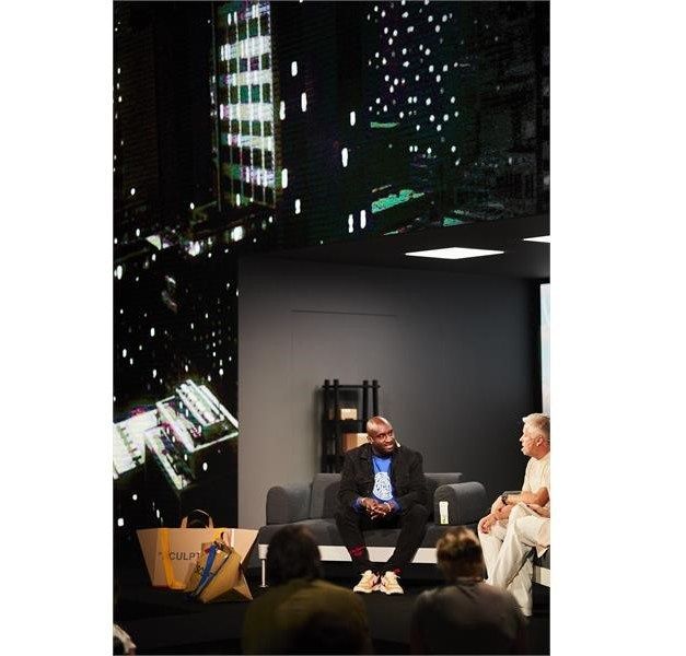 Two people on stage at an event.