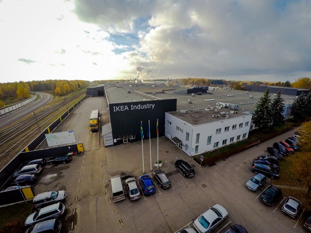 Aerial view of an IKEA Industry building beside a railway line.