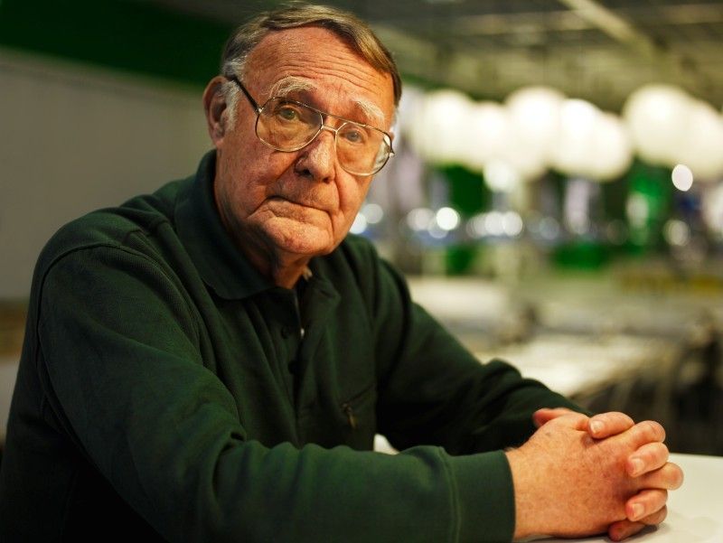 Ingvar Kamprad seated indoors with hands clasped and looking at the camera.
