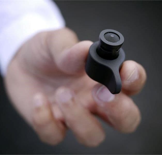 A hand holding a black MISTELN water nozzle.
