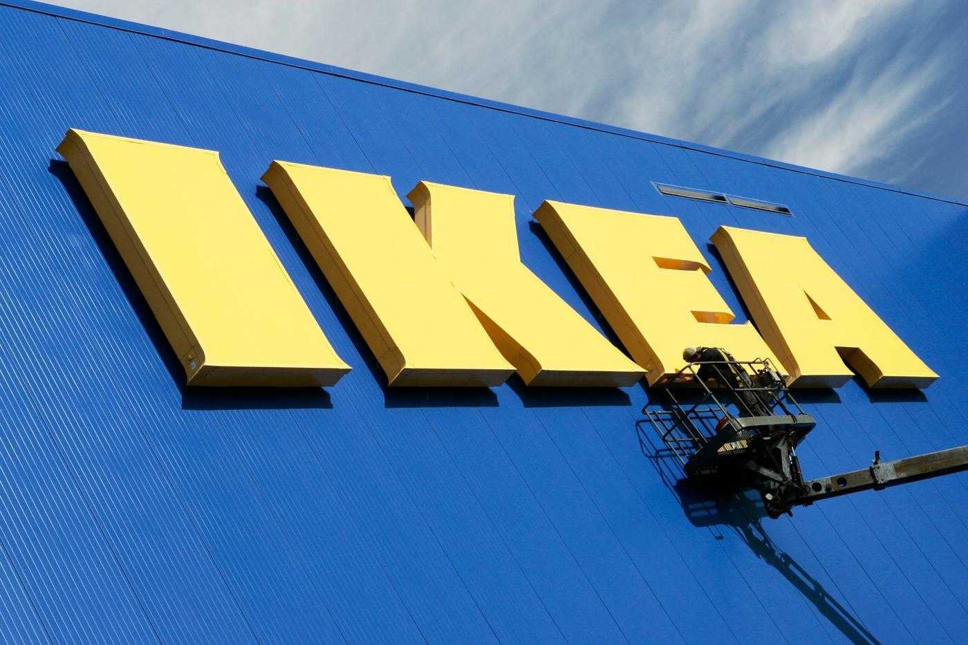 Blue facade of an IKEA store with yellow IKEA wordmark.