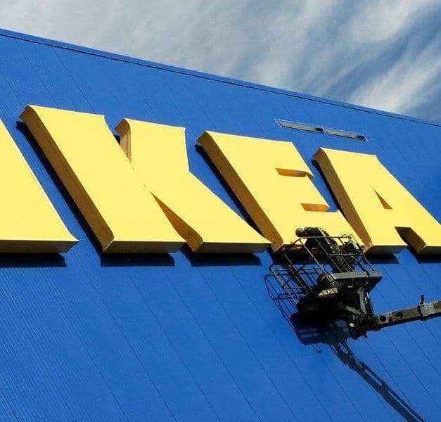 View of IKEA store exterior, with blue facade and yellow IKEA wordmark.