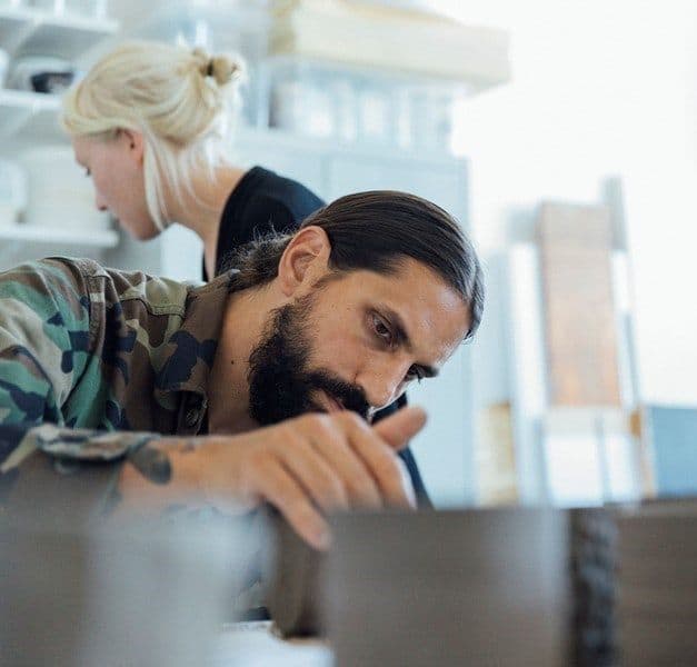 People working on the design of scented candles.