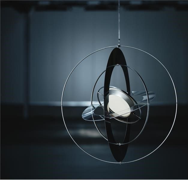SAMMANLÄNKAD prototype hanging in a dark room.