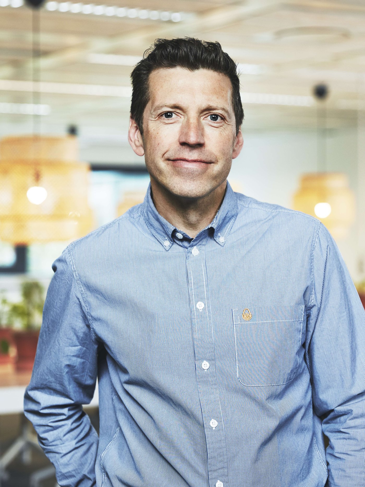 Portrait of Per Krokstäde wearing a light blue shirt.