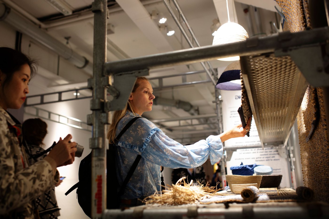 People viewing a display of the products from the FÖRÄNDRING collection.