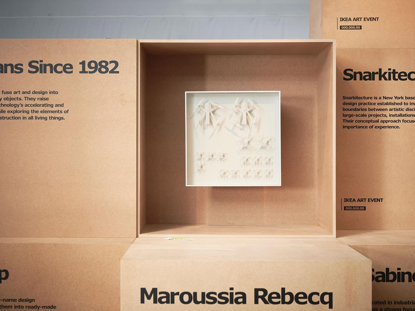A prototype by Humans Since 1982 on exhibition in a an open-sided MDF cube.
