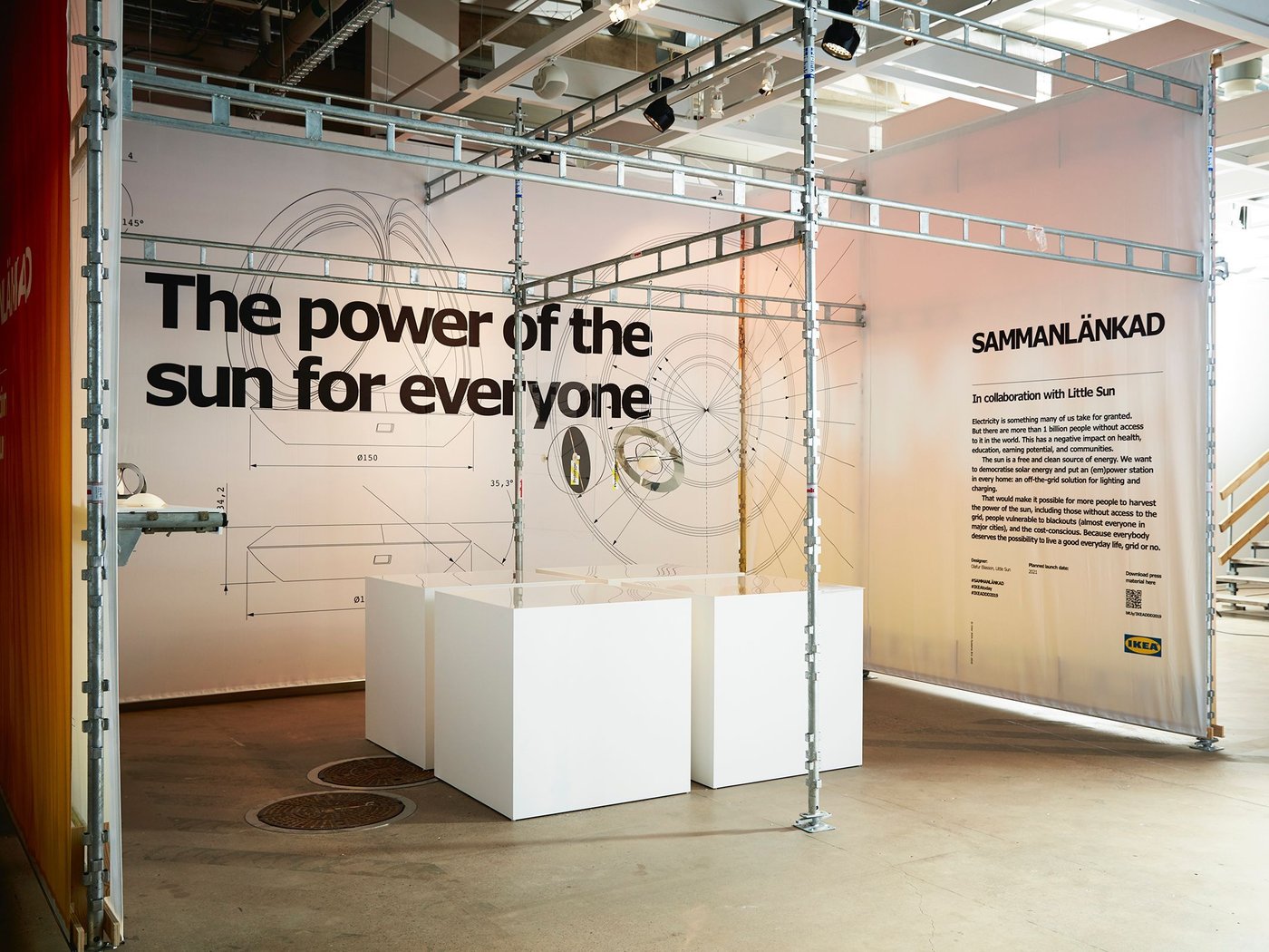Exhibition space with text on the walls reading "The power of the sun for everyone".