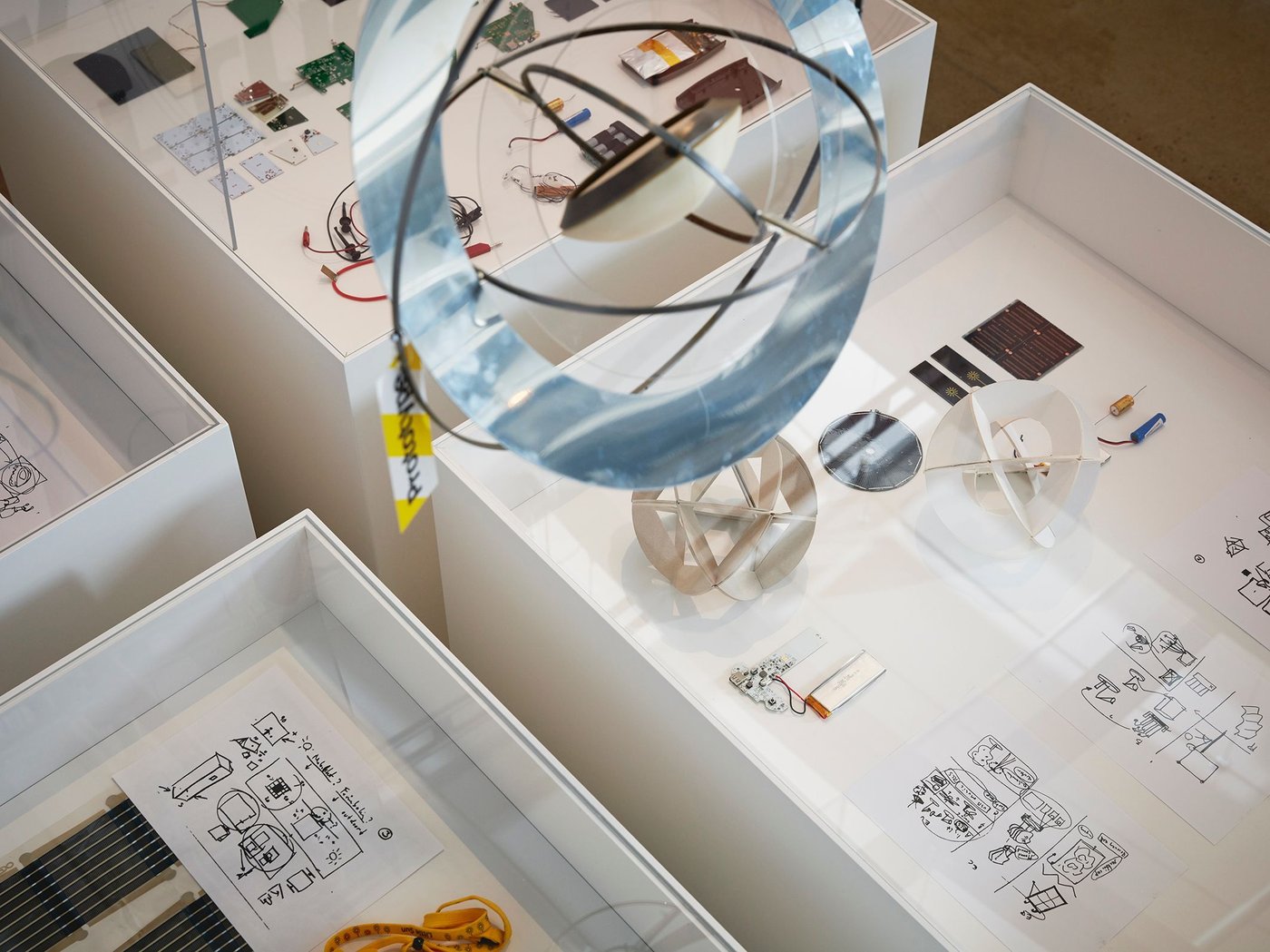 SAMMANLÄNKAD sketches and prototypes exhibited in a clear-topped display boxes.