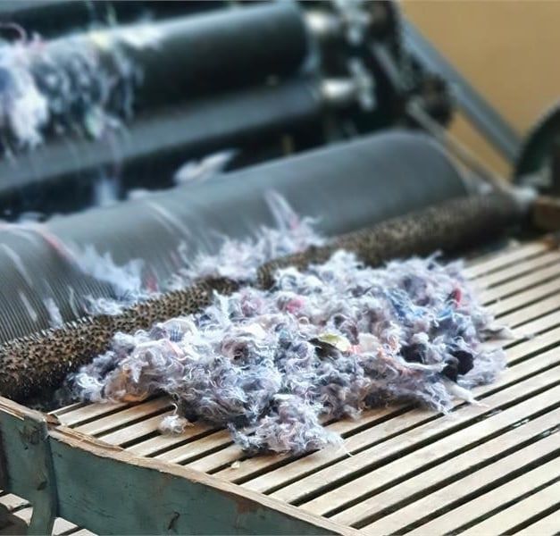 Textile fibres being shredded.