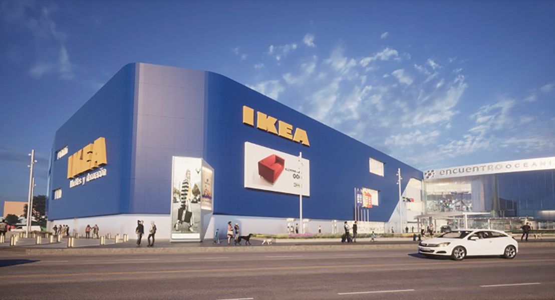 A rendering of an IKEA store. It shows the facade of the store in blue and a car park.