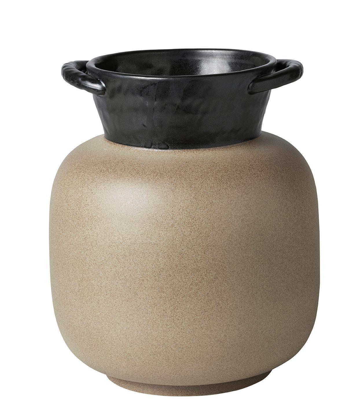 A beige and brown vase with handles against a white background.