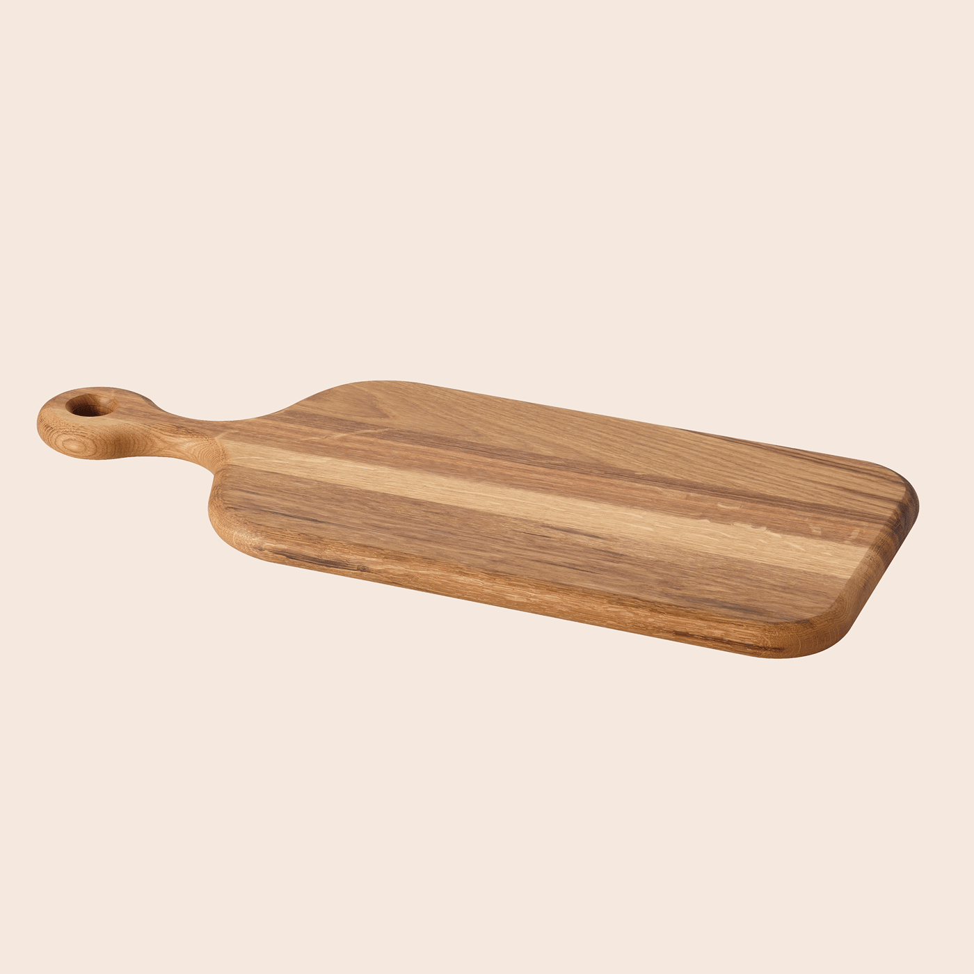 ARTISTISK chopping board on a light peach background.