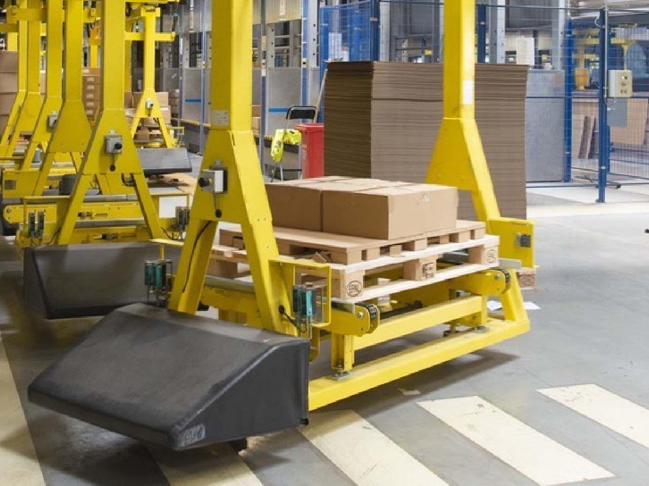 IKEA boxes on pallets in a factory.