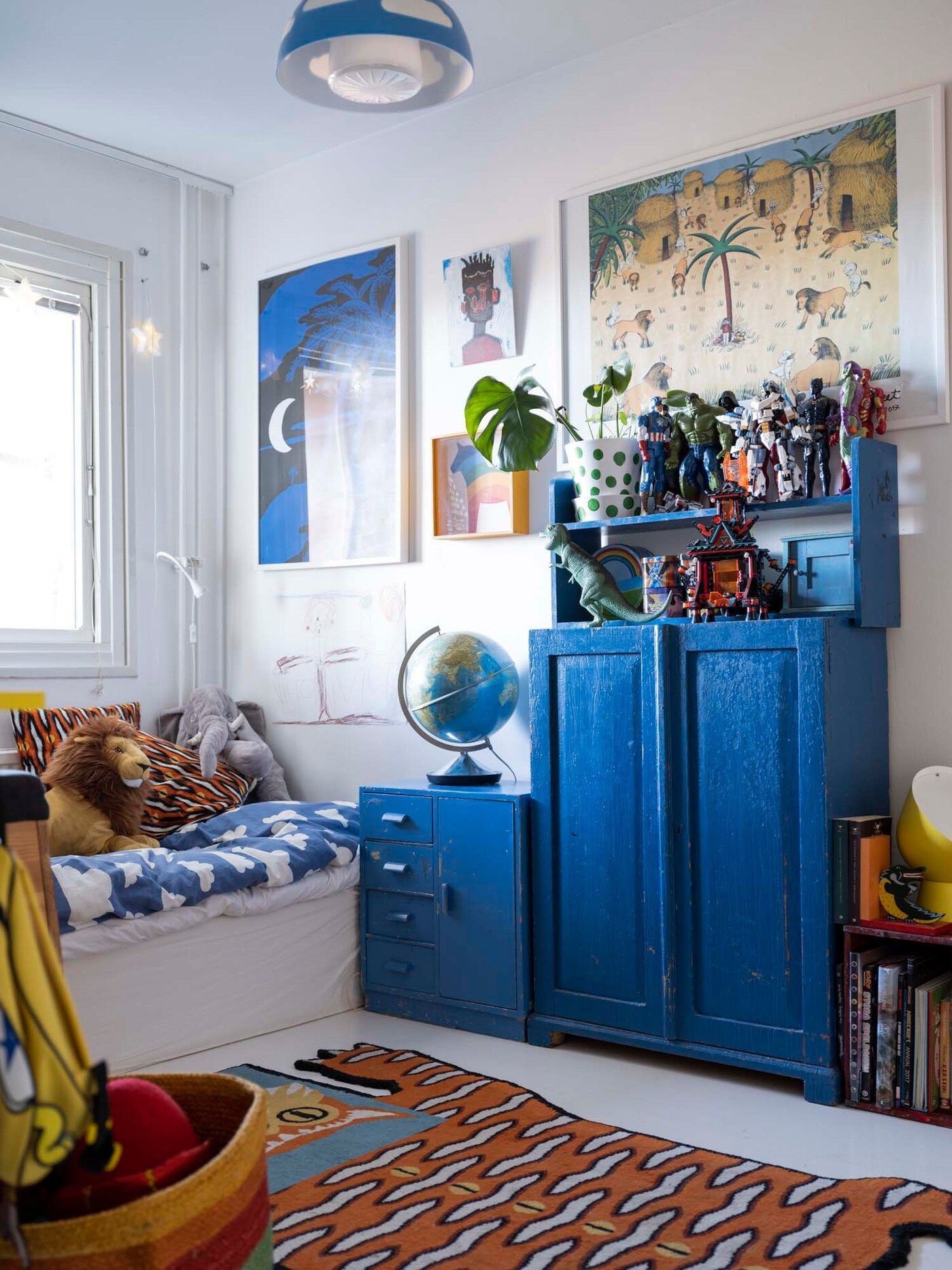 A blue theme in Victor's room. Furniture is painted blue.