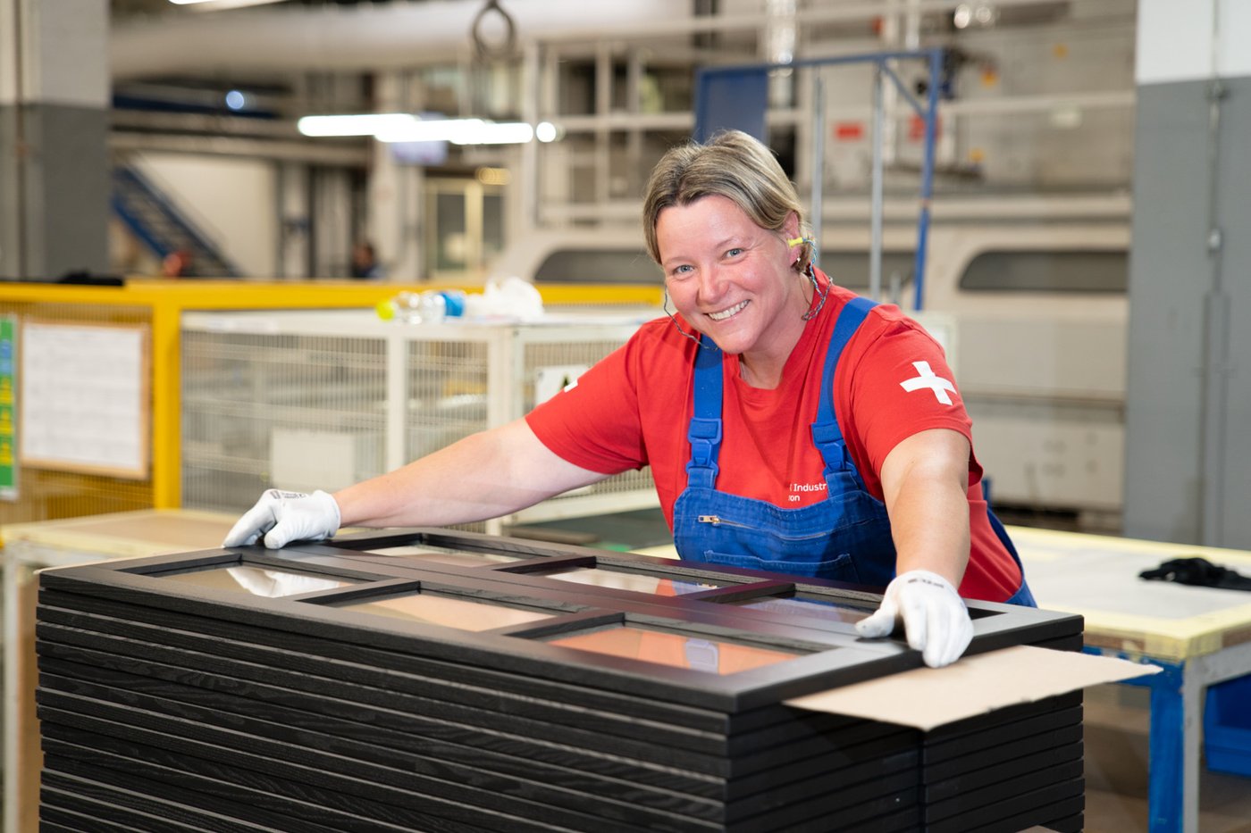 An IKEA Industry co-worker smiling in a factory in Sopron.