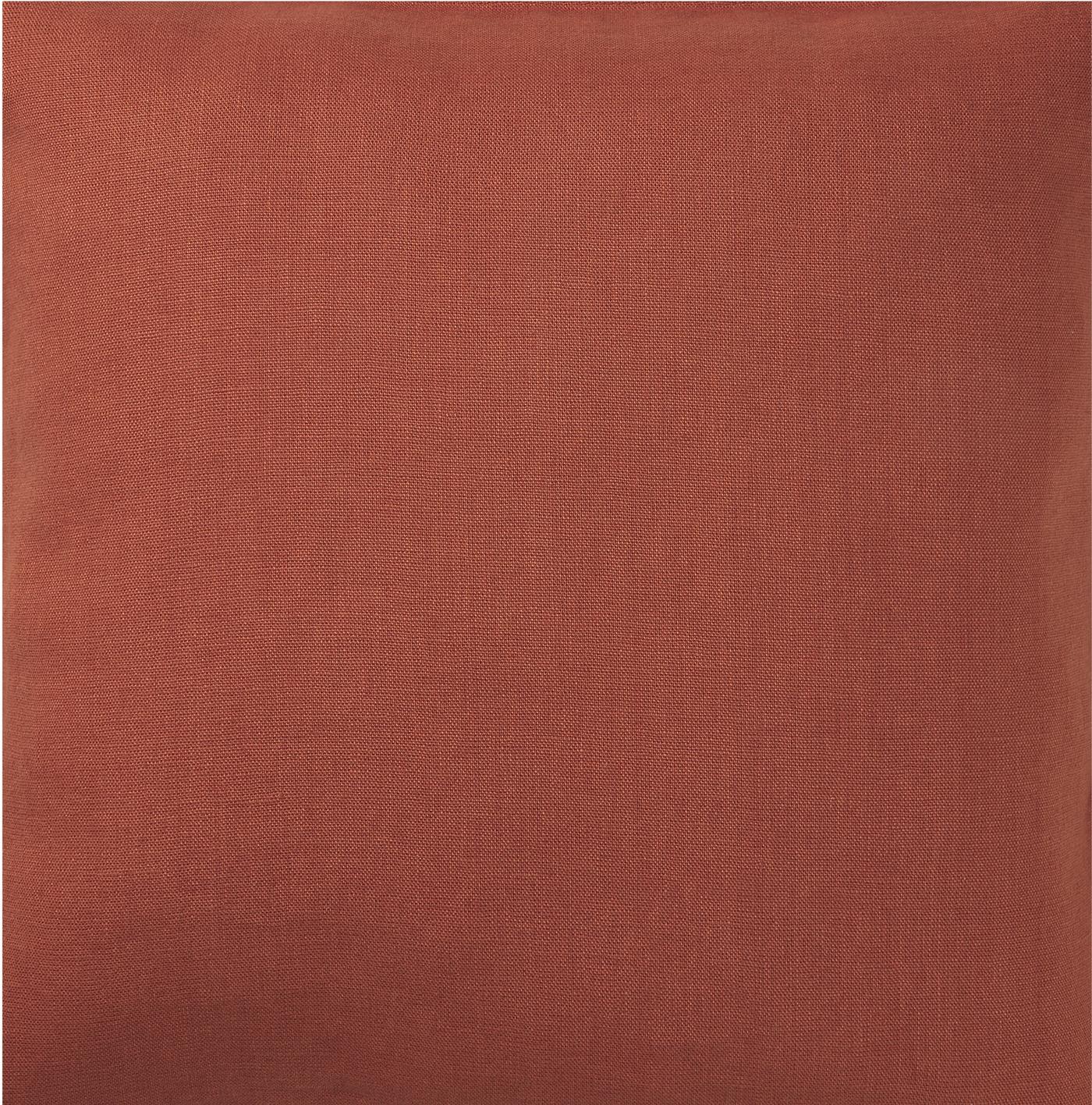 Close-up of DYTÅG cushion cover in a rust colour.