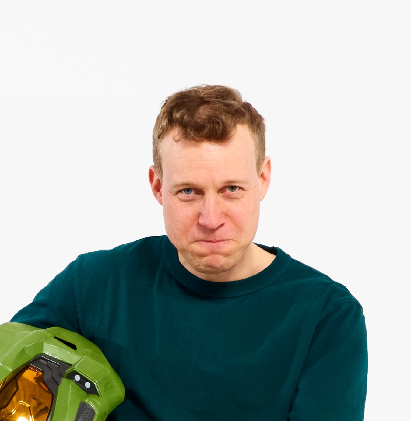 IKEA designer David Wahl, holding a green helmet.
