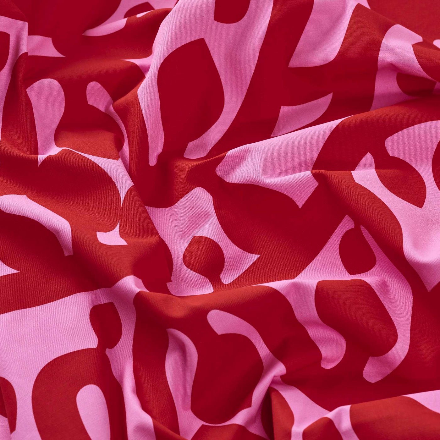 A close-up image of a piece of FLUGBLOMSTER fabric, wrinkled.