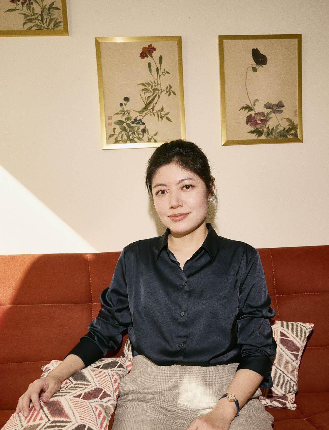 Yajun sits on the sofa.