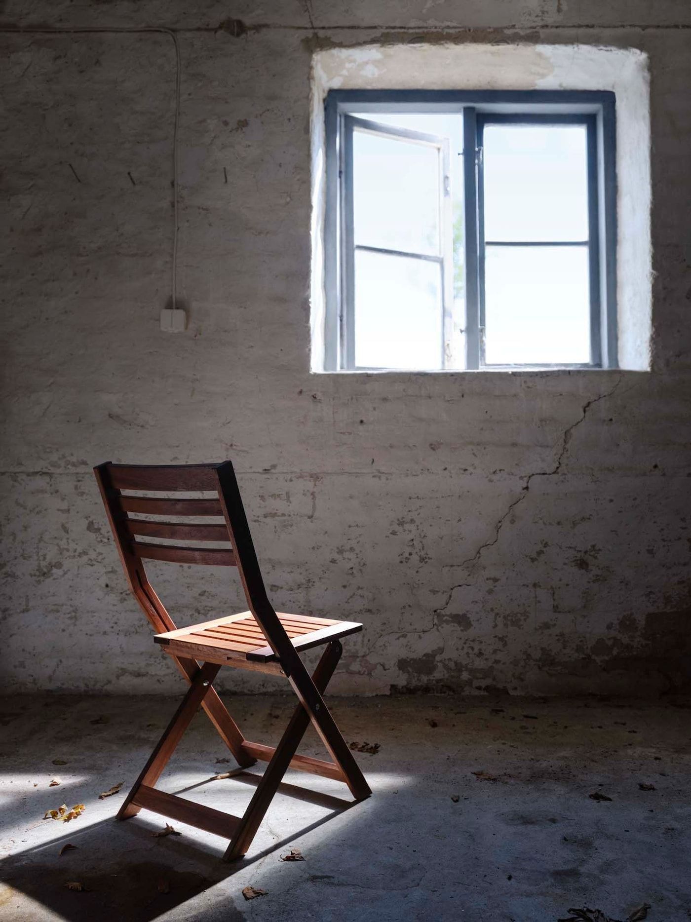 APPLÄRÖ outdoor chair in a storage area.