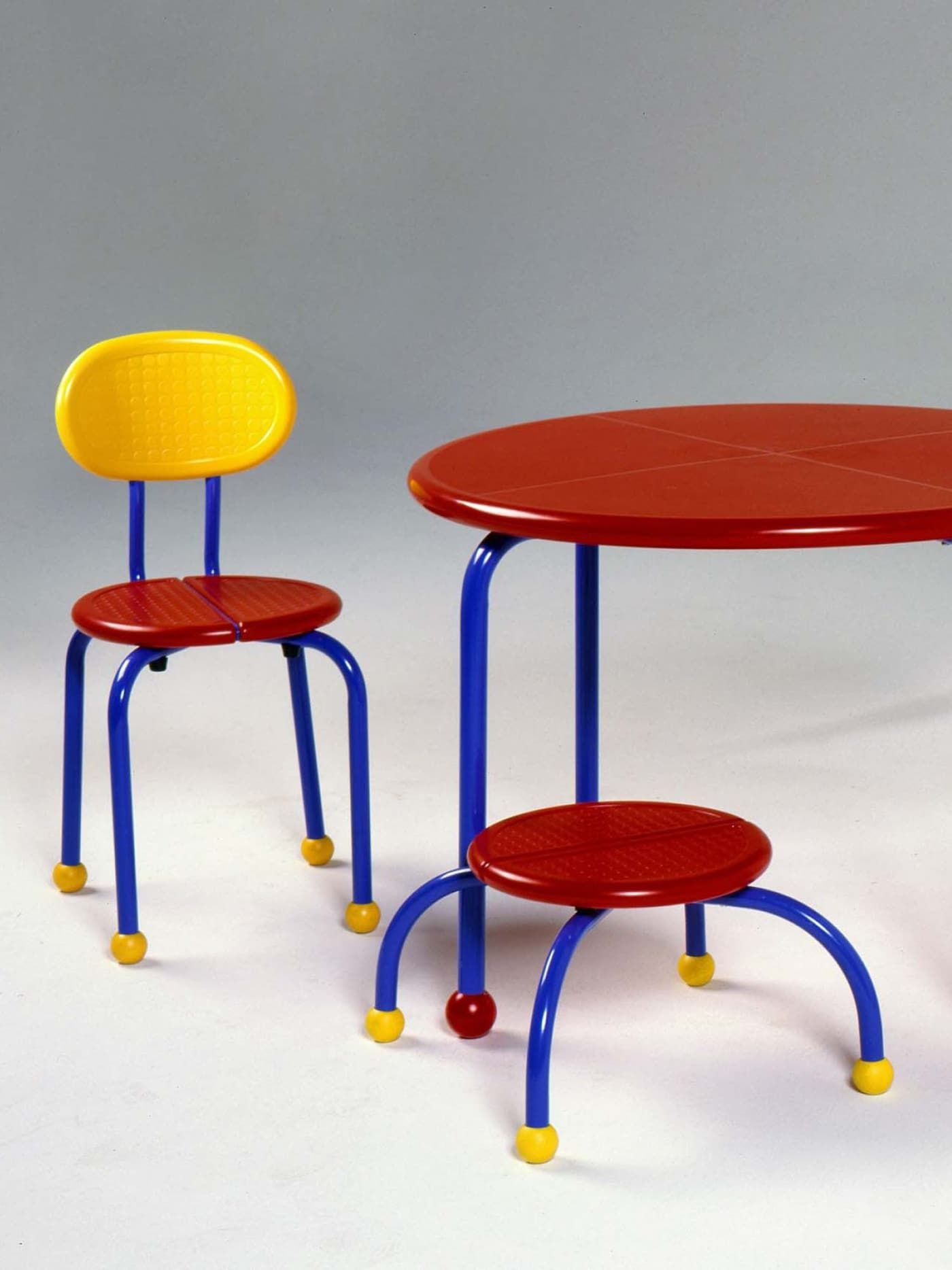 KOBRA children's chair stool and table in red, yellow and blue.