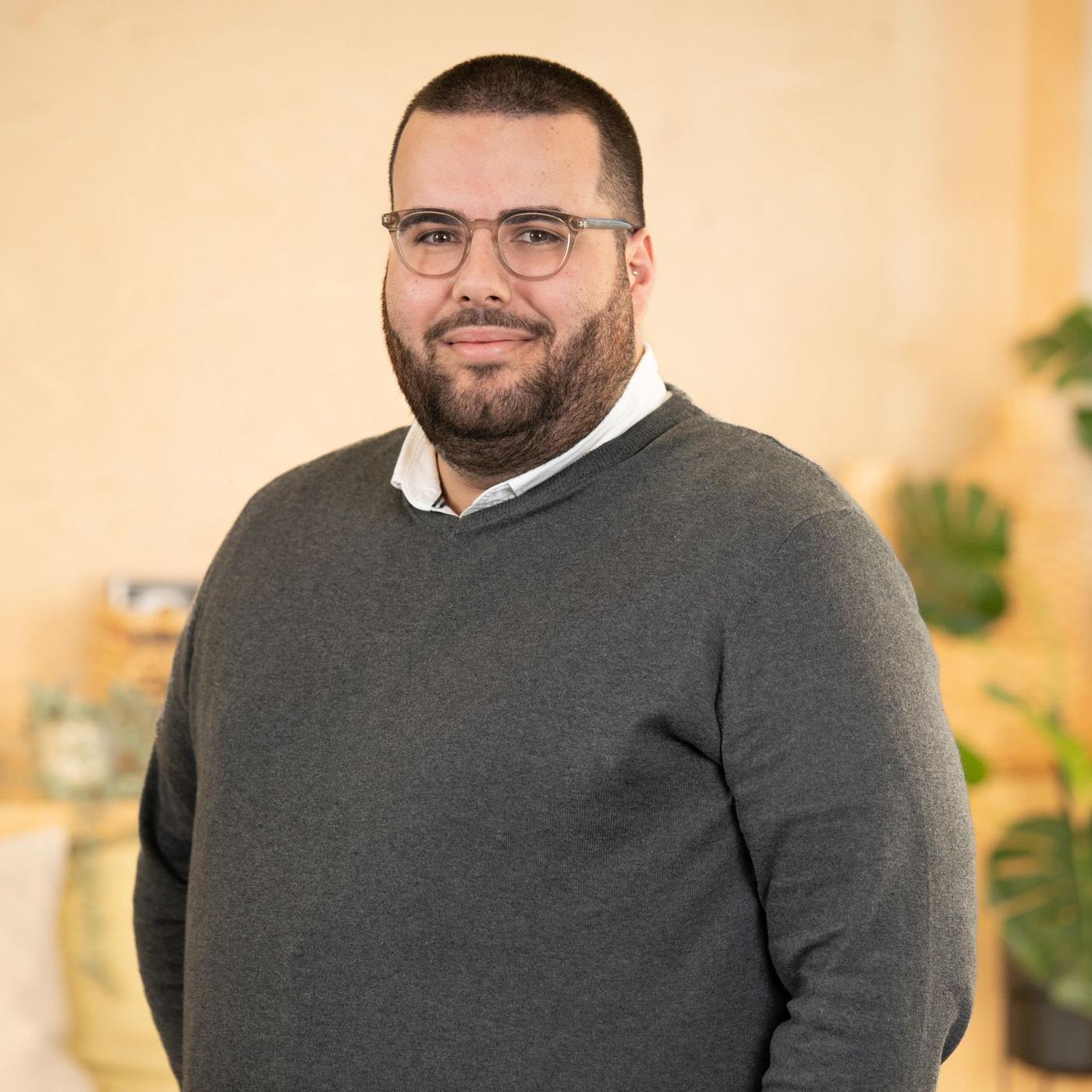 IKEA co-worker Daniel smiles at the camera.
