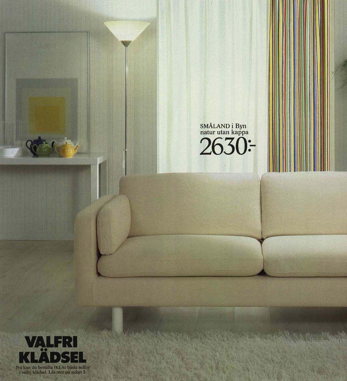 An image from the 1984 IKEA catalogue featuring a white sofa, with an uplighter floor lamp behind.