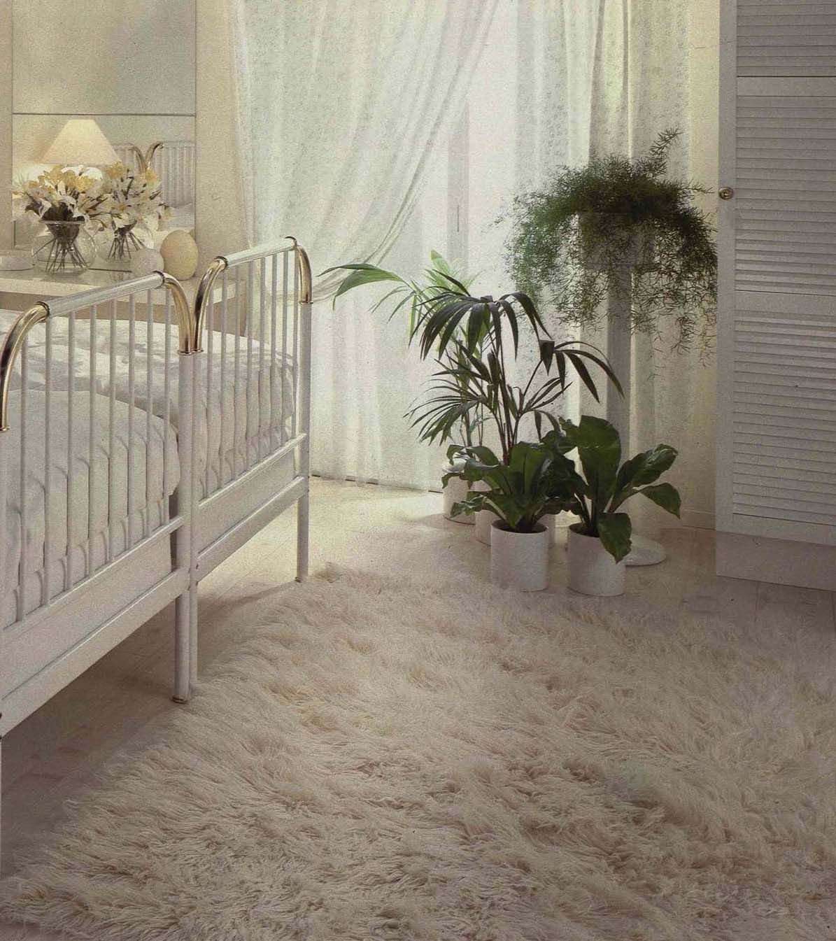 An image from the 1984 IKEA catalogue featuring a white bedroom with plants.