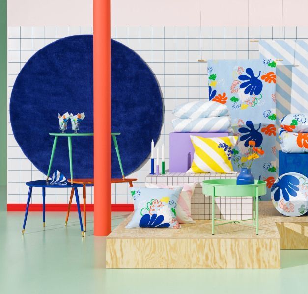 A collection of colourful IKEA vintage products standing in a room.