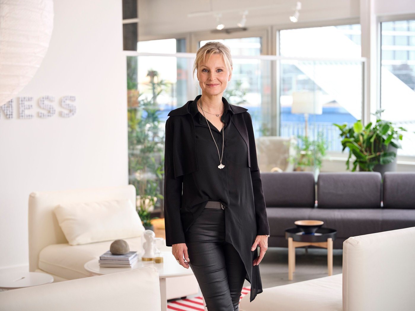 Elisabeth Munck af Rösenschold, wearing black, standing in front of the camera.