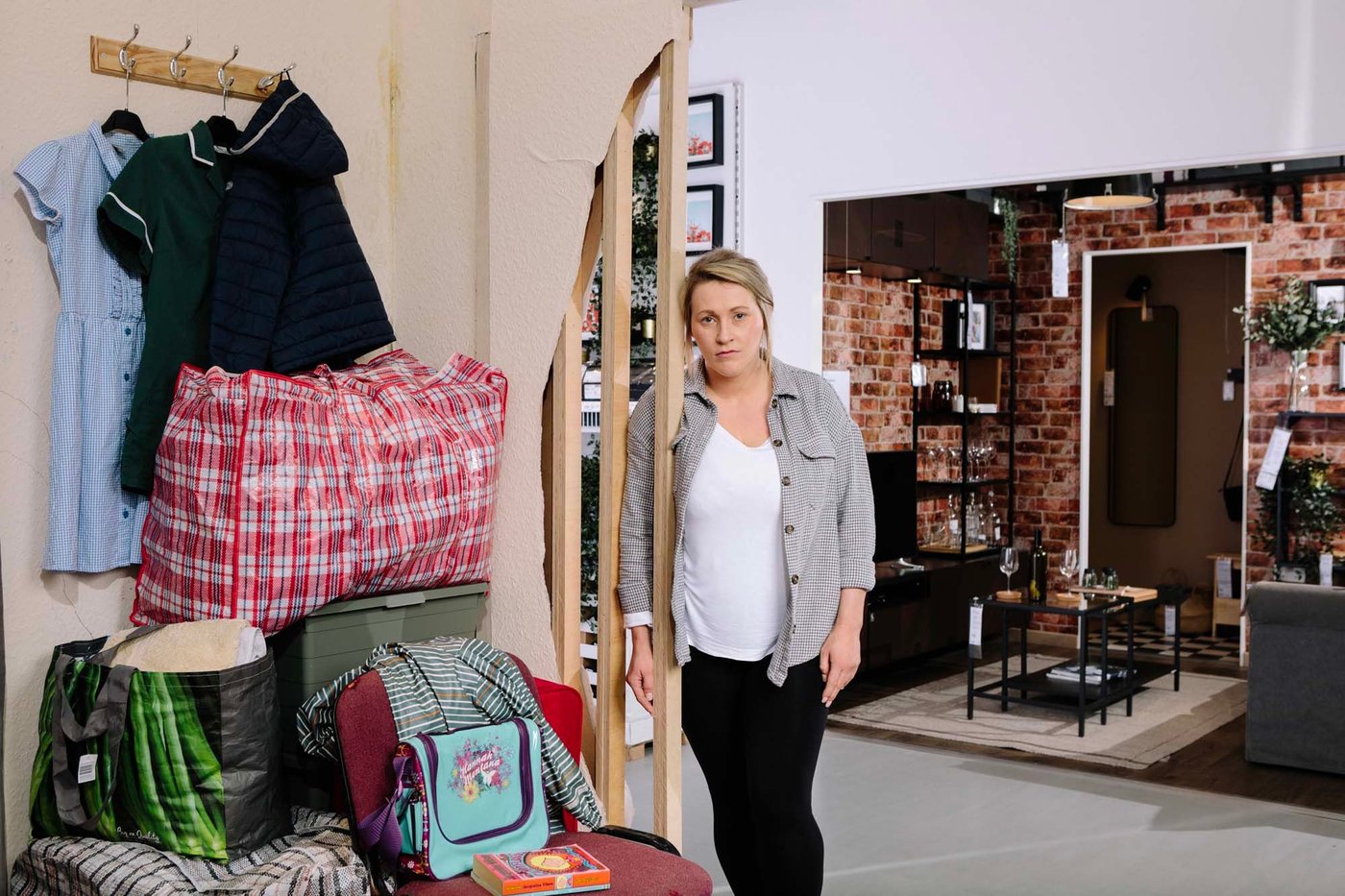 Sam stands at the entry to the real-life roomset based on her story at the IKEA Hammersmith store.