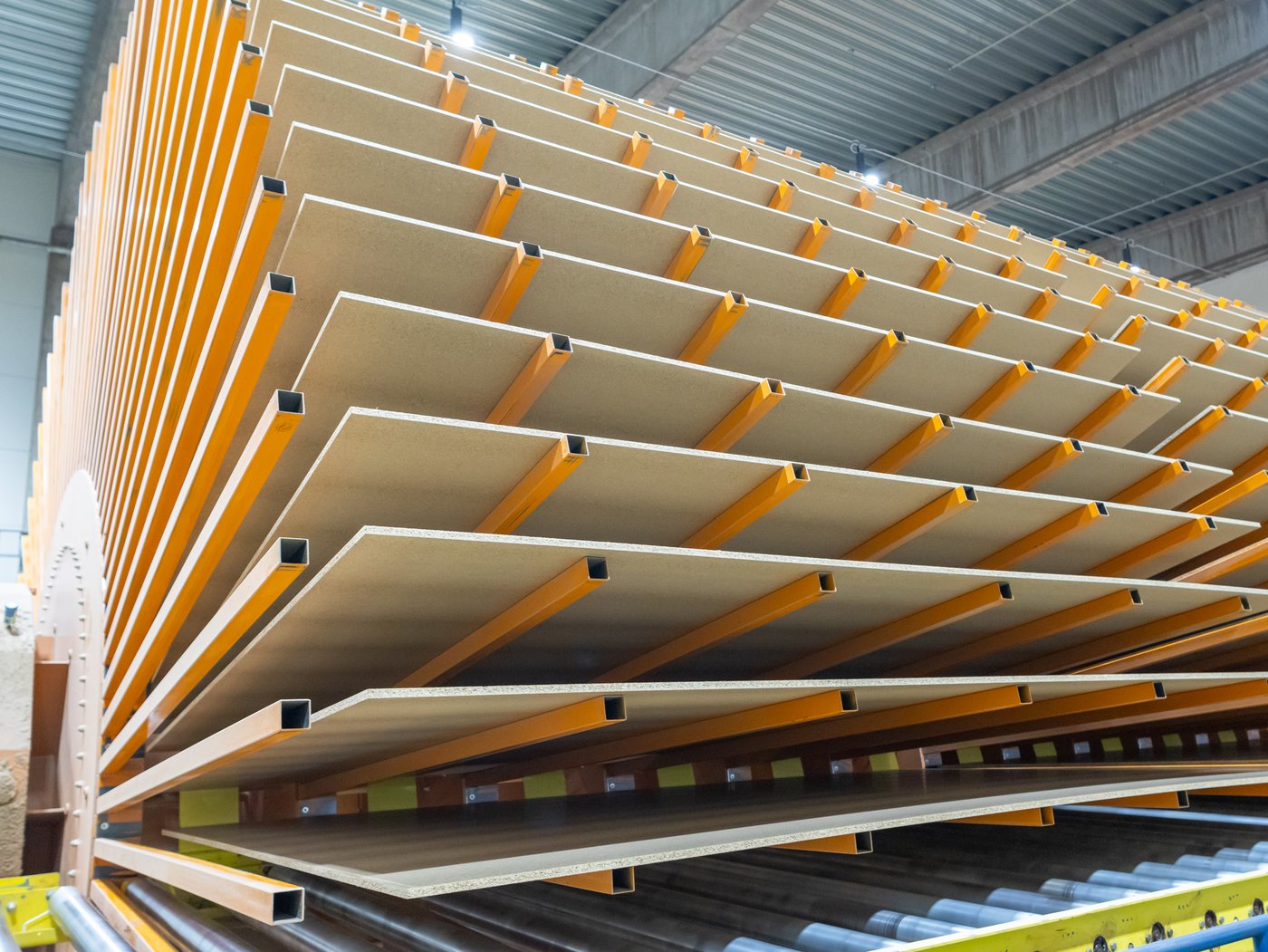 A rack of particle boards in a factory.