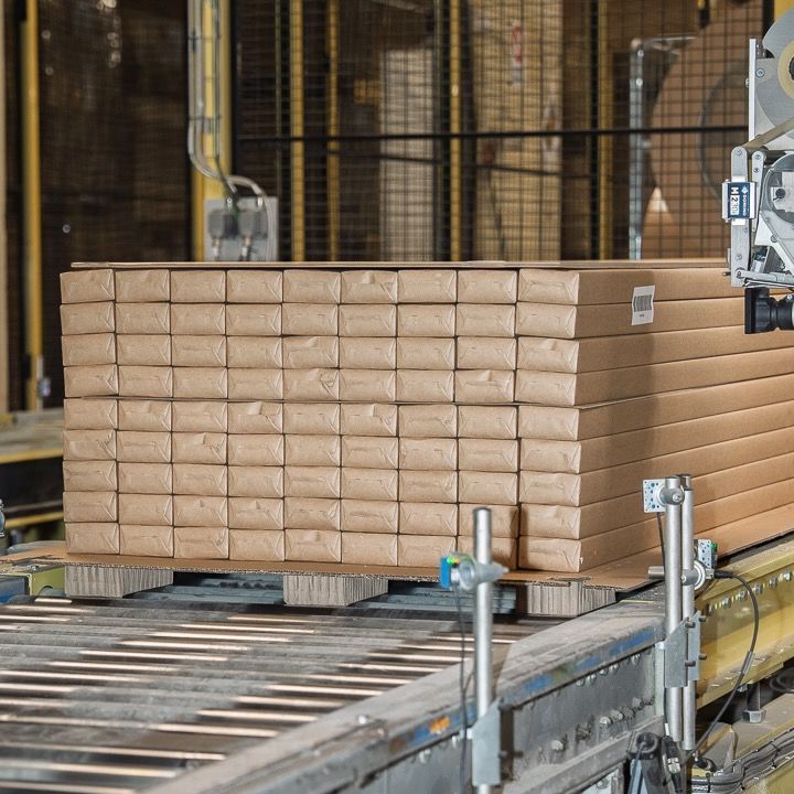 Packaged IVAR shelving units on a pallet in the Hedlunda factory.
