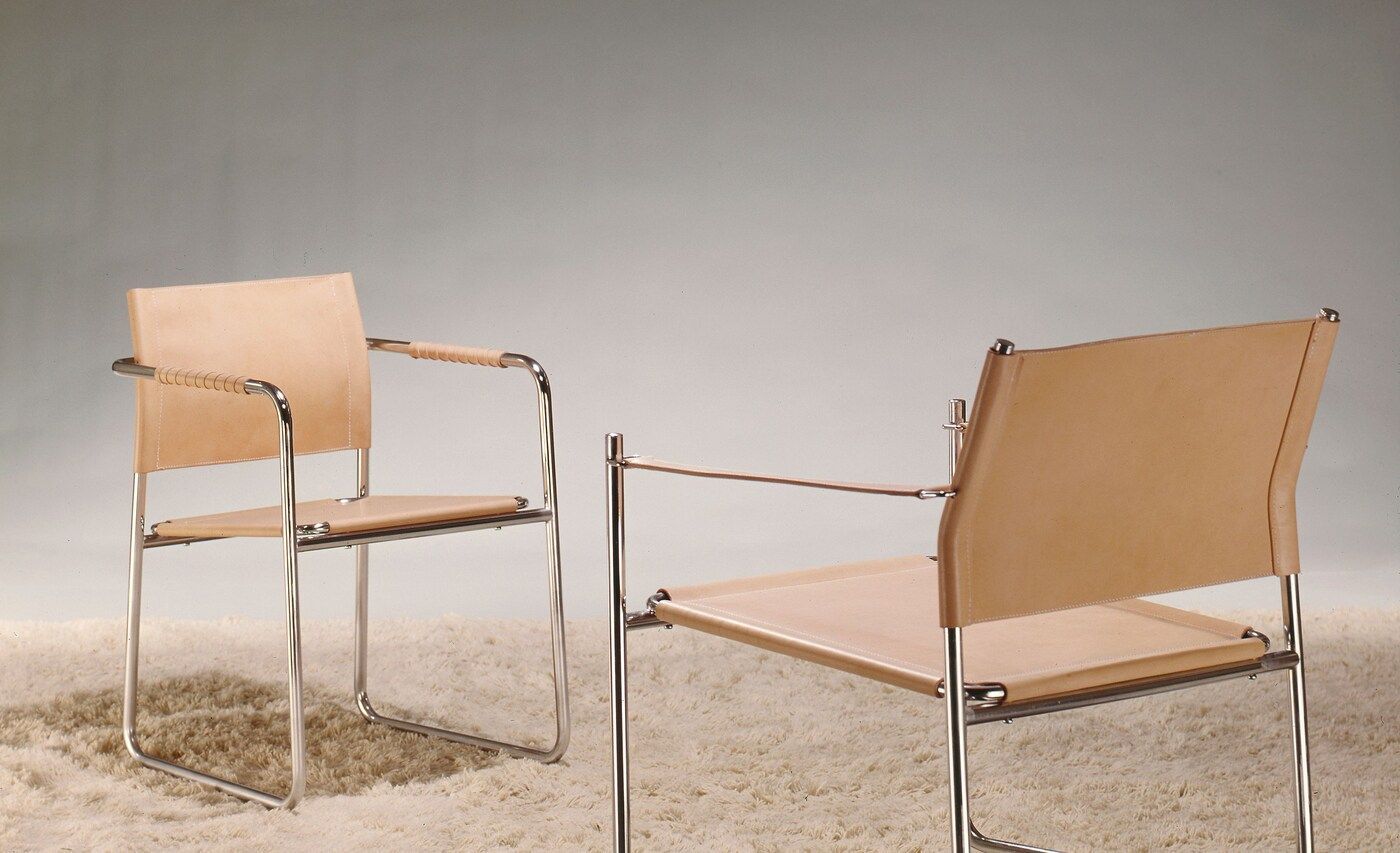 Two AMIRAL chairs sit on a light coloured rug.