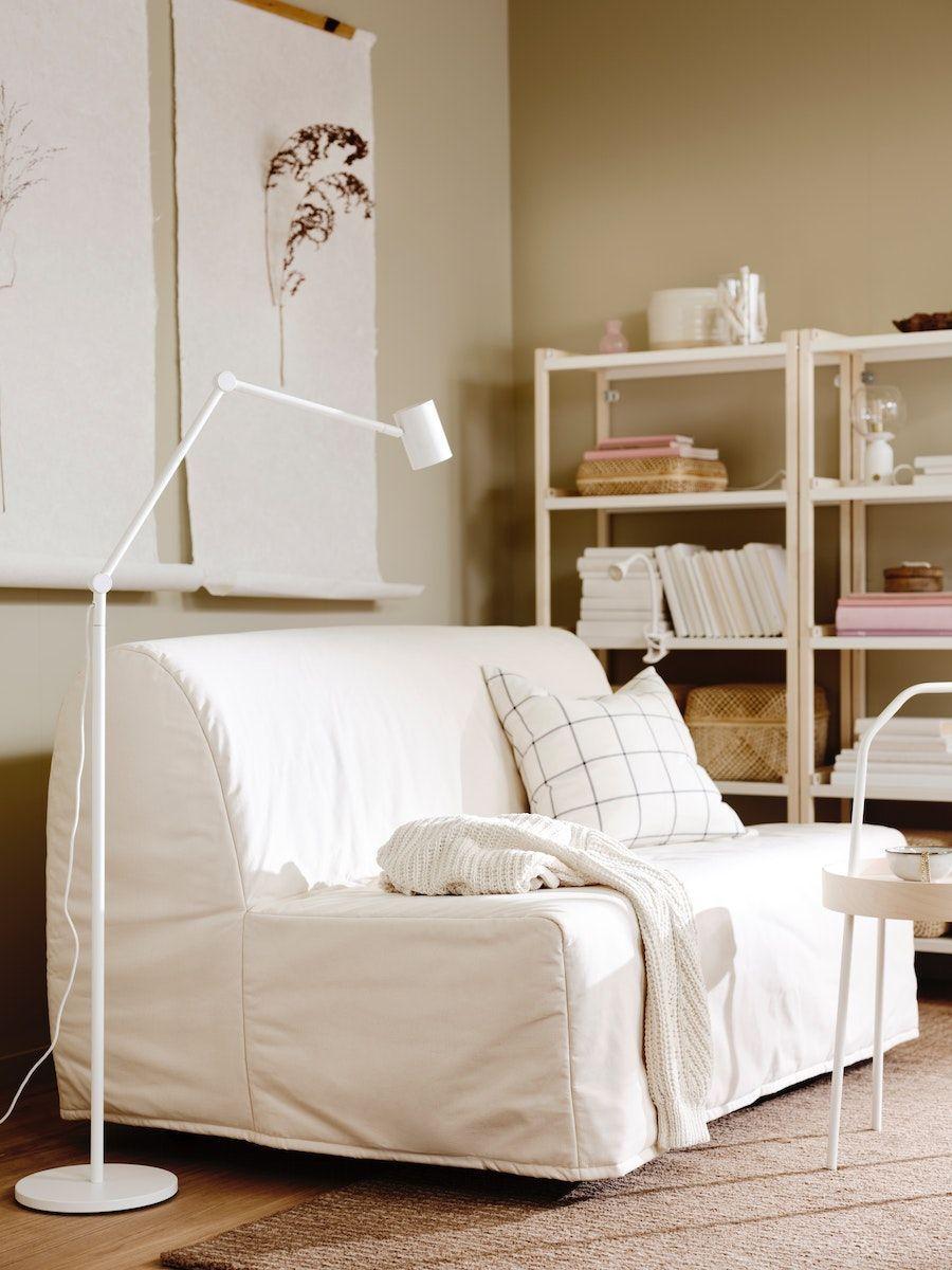 A white LYCKSELE LÖVÅS sofa with a lamp beside it.