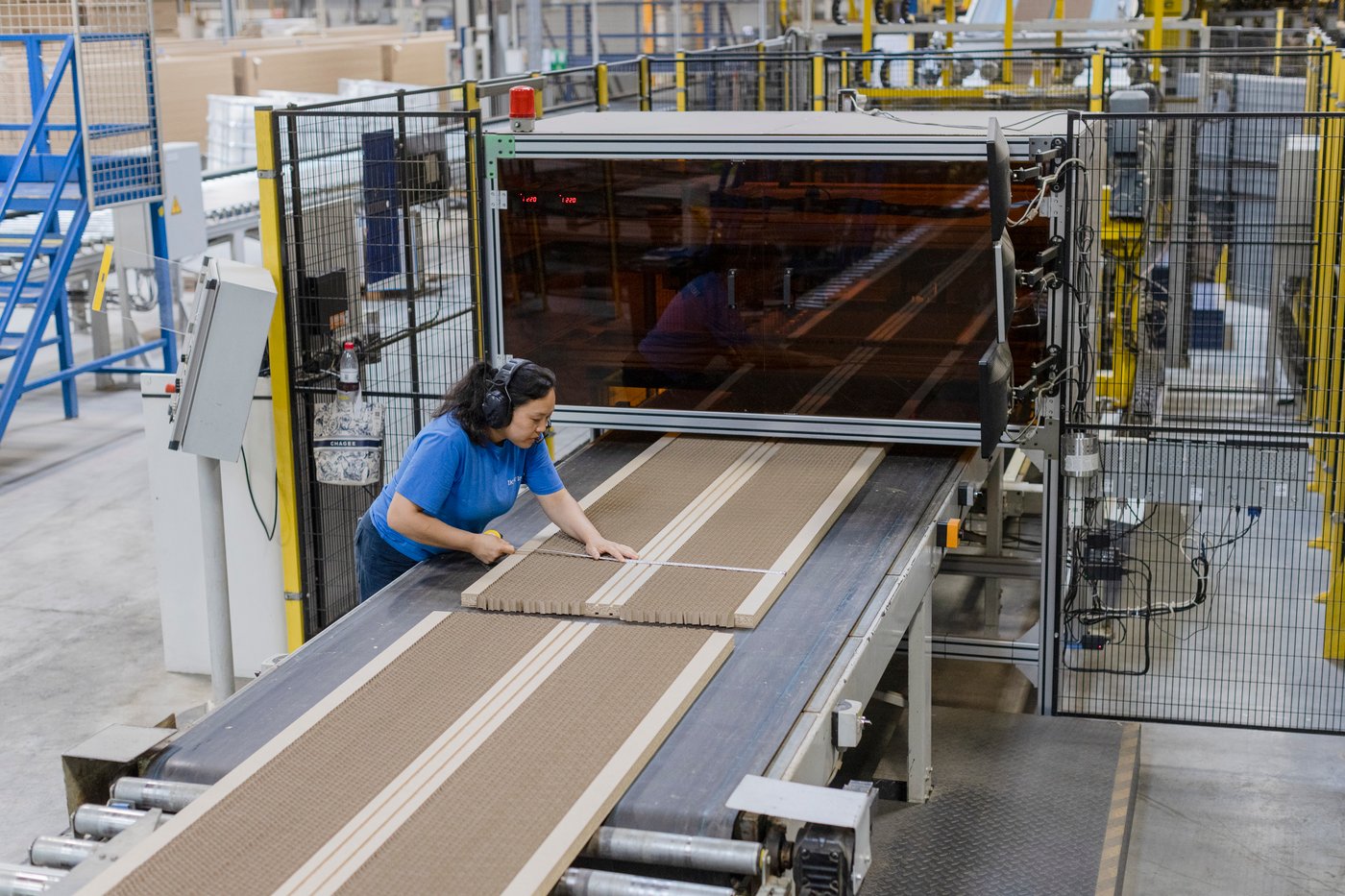 A person works machinery in the Nantong factory.