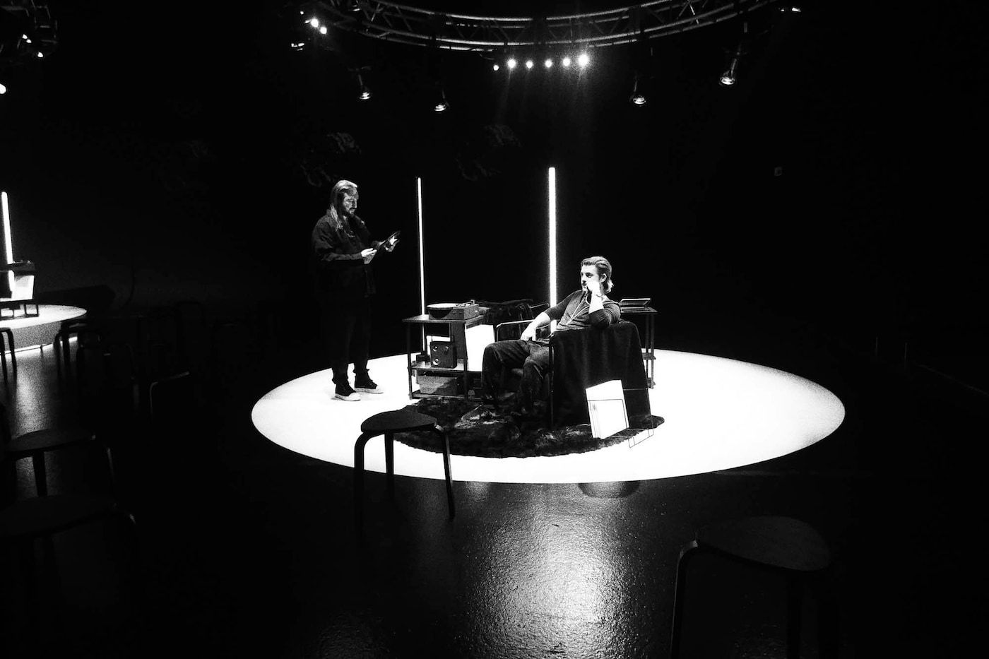 Swedish House Mafia members on a round, white stage with products from the OBEGRÄNSAD collection.
