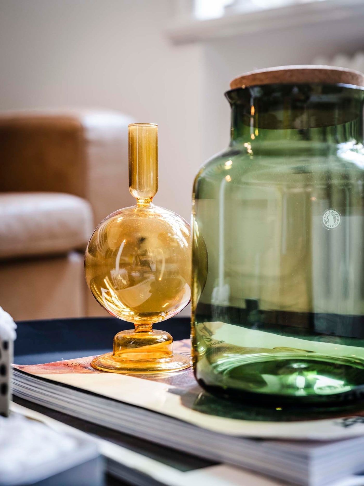 Coloured glassware on a coffee table.