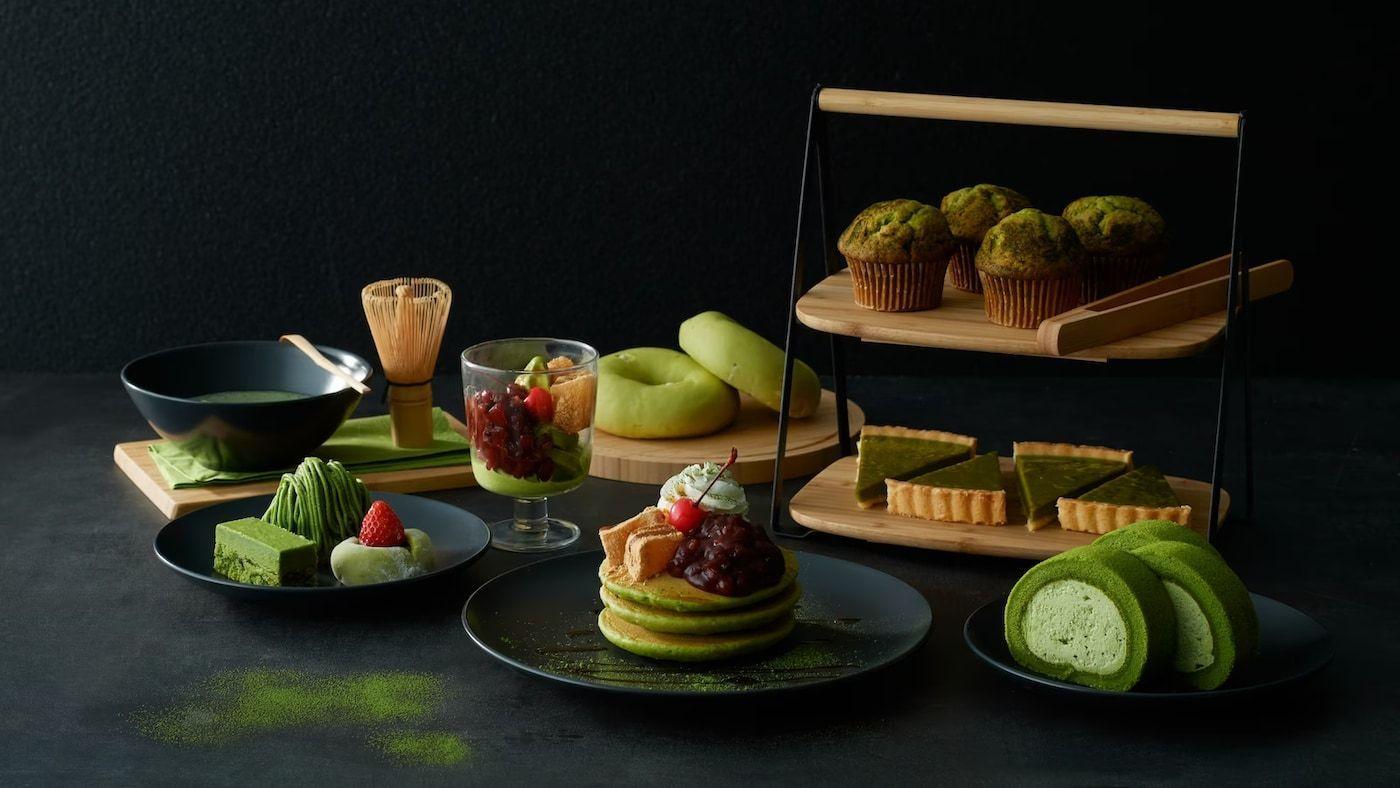 A spread of green matcha desserts from IKEA Japan against a dark backdrop.