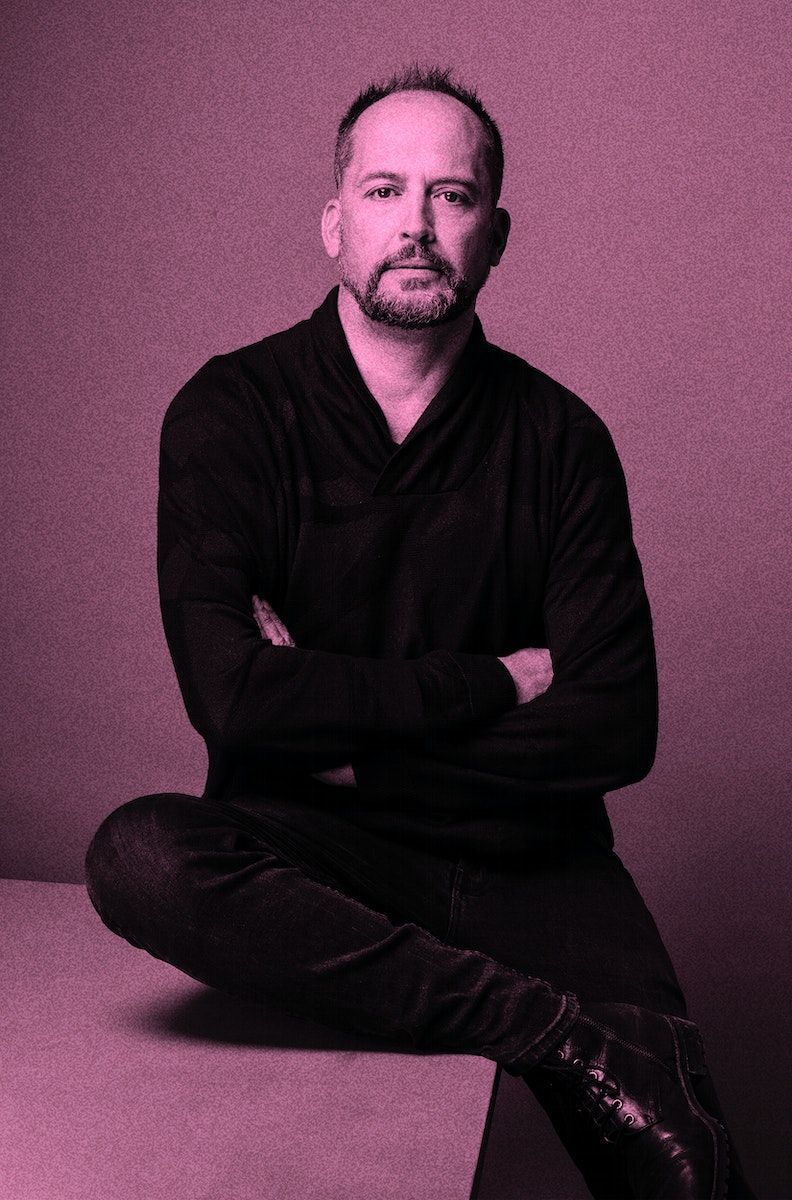 A pink colour-washed portrait of Felipe Assadi.