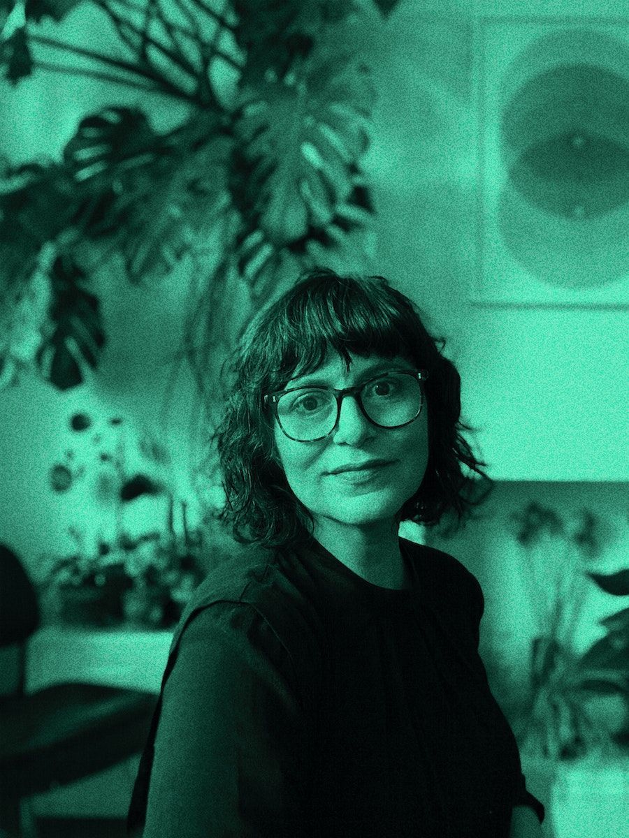 A green colour-washed portrait of Liliana Ovalle.
