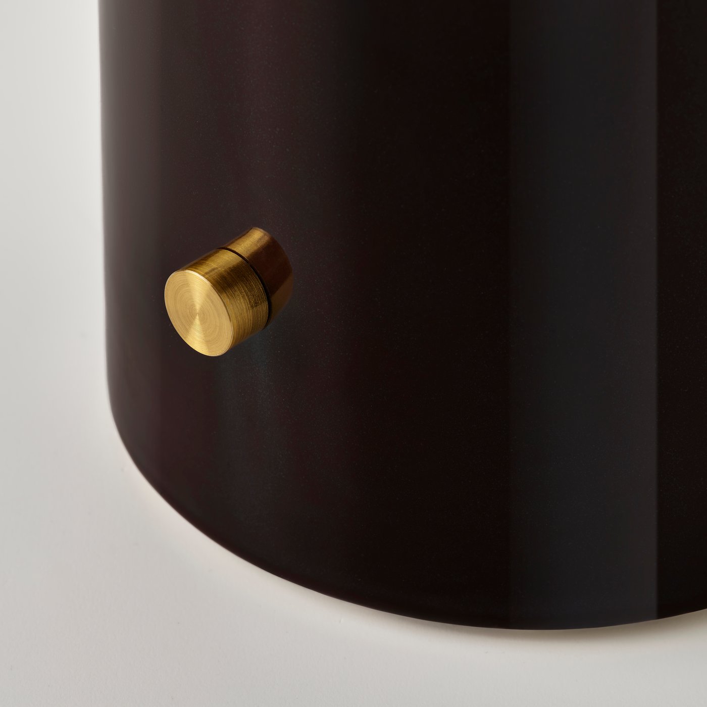 Dark glazed ceramic lamp base with a brass dimmer knob.