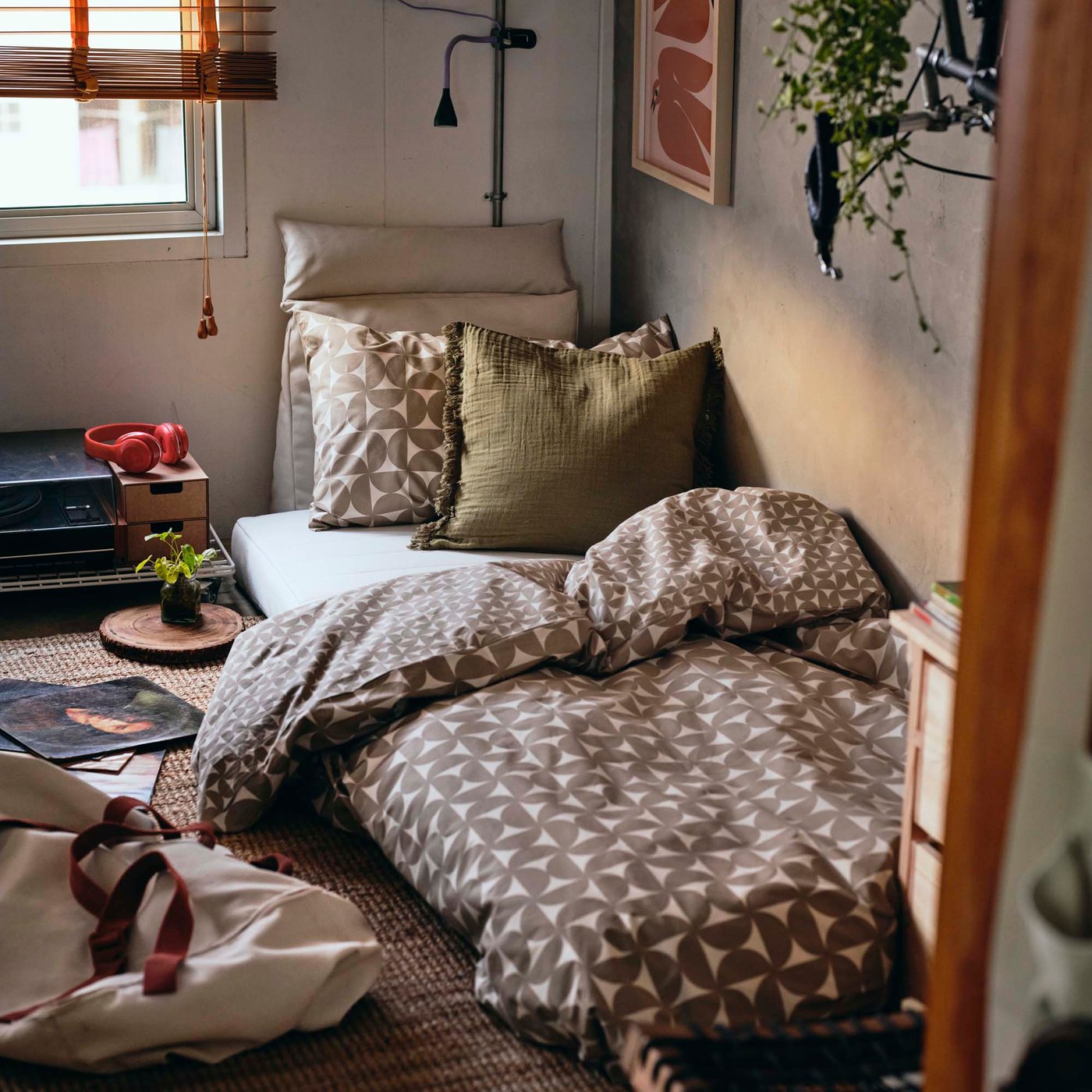 A single bed by the wall in a sitting room.