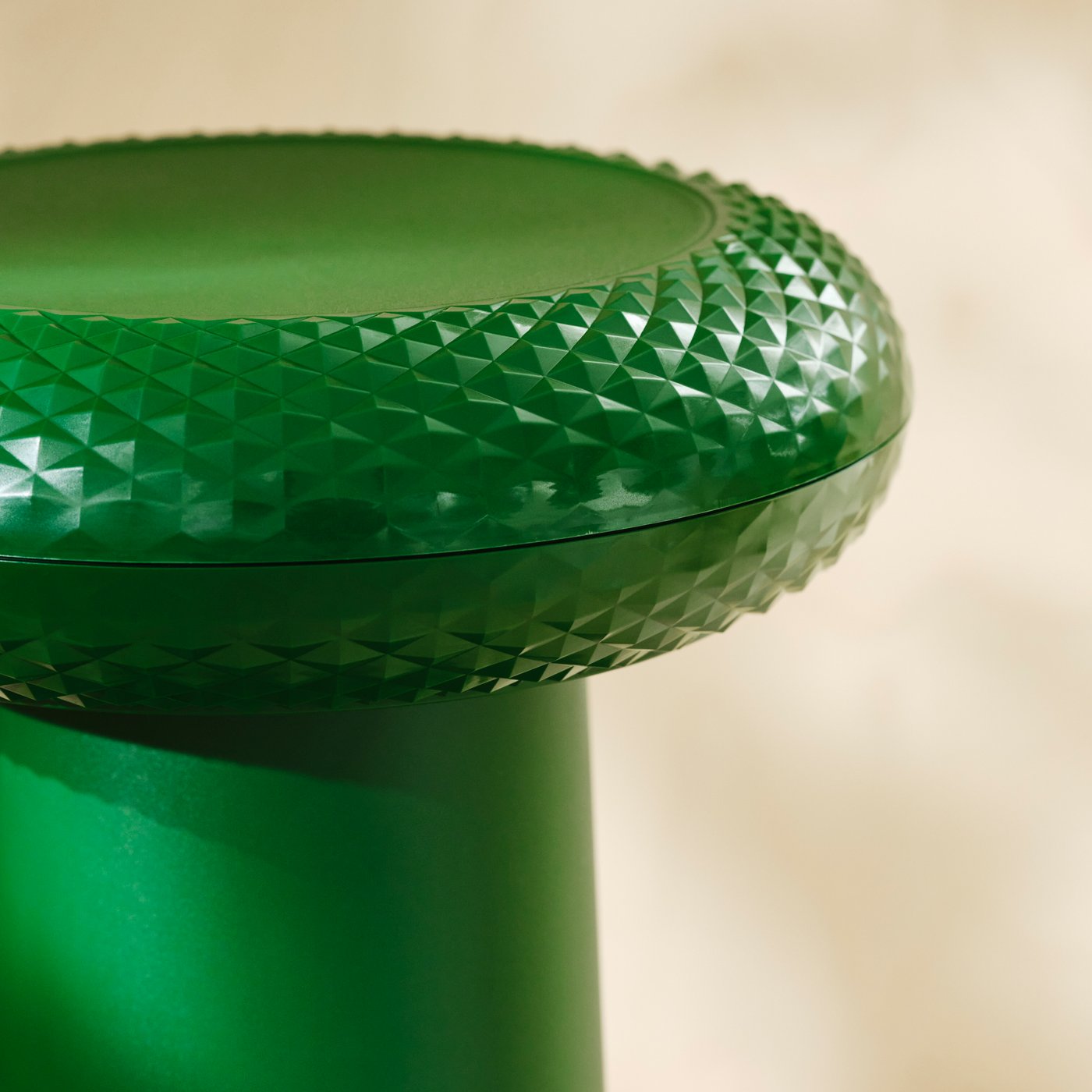Close-up of the textured seat on a green thumbstick-inspired stool.
