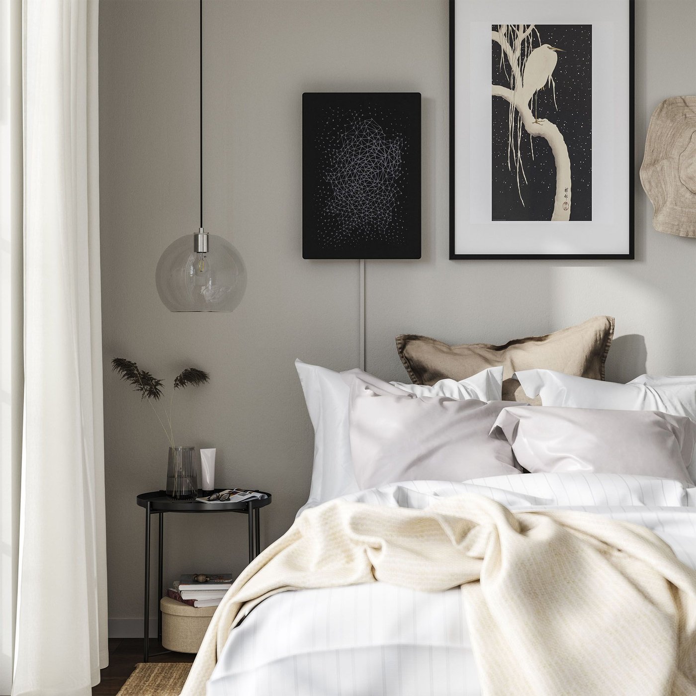 A bedroom with a black/smart SYMFONISK picture frame with WiFi speaker hung on the wall above a made bed.