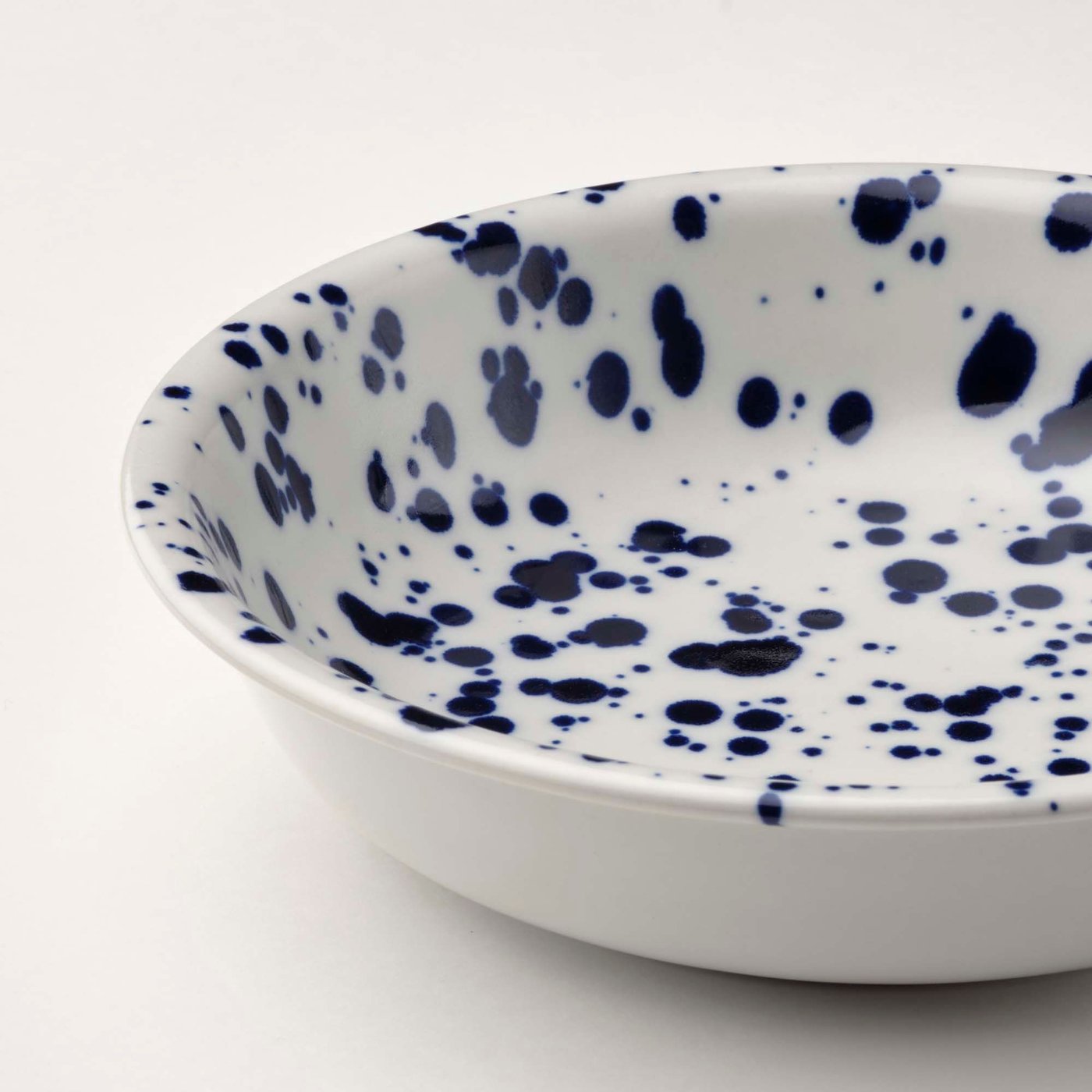 Close up of a SILVERSIDA deep plate on a white background.