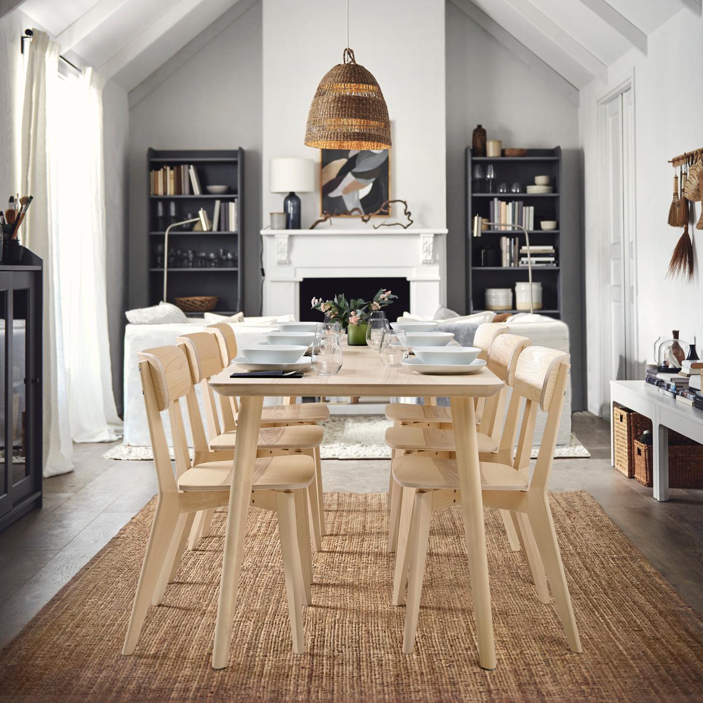 The LISABO light blonde dining table with coordinating chairs in a serene Scandinavian dining space.